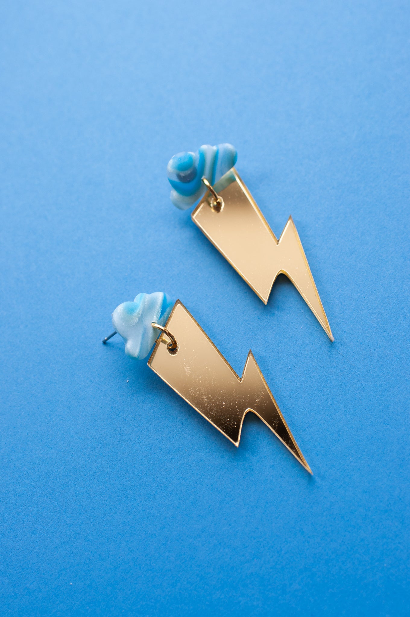 Blue Cloud Mirrored Gold Lightning Bolts