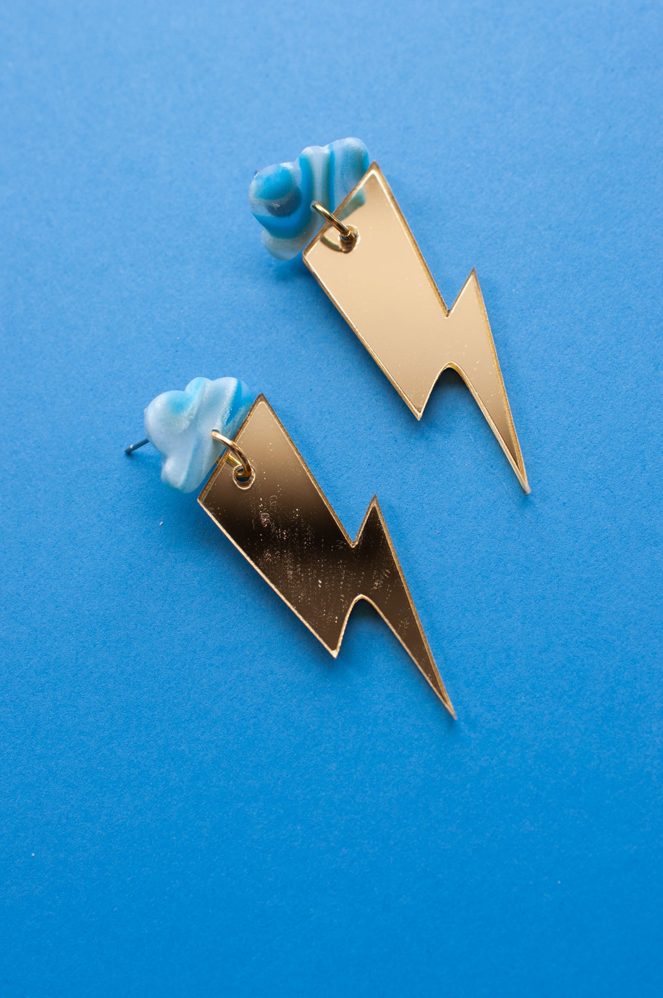 Blue Cloud Mirrored Gold Lightning Bolts
